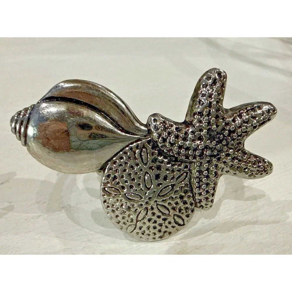 vintage silver-toned napkin rings Figuring Seashells